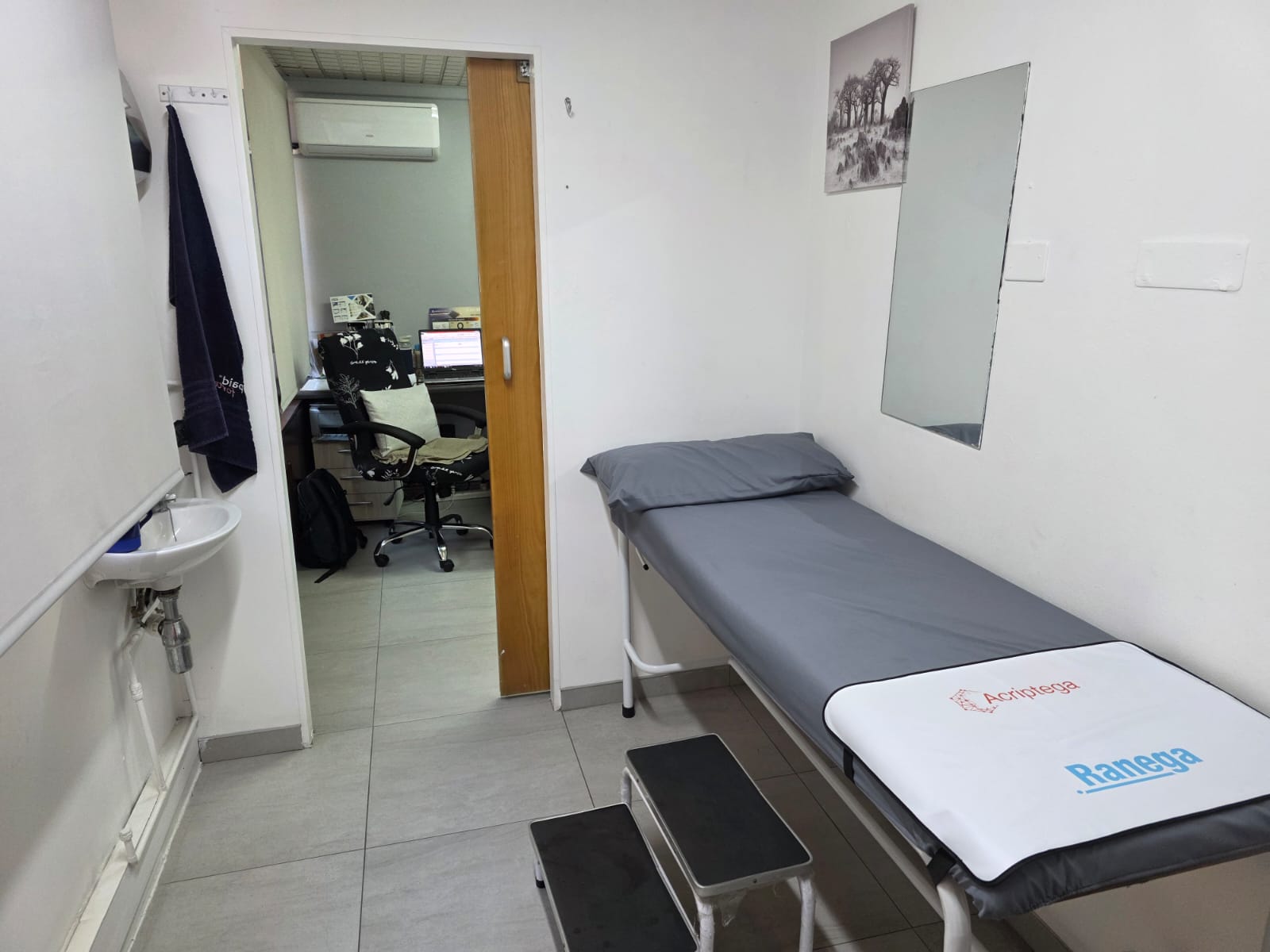 Examination room with patient bed